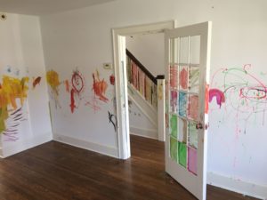 walls, door and staircase painted by kids during painting party