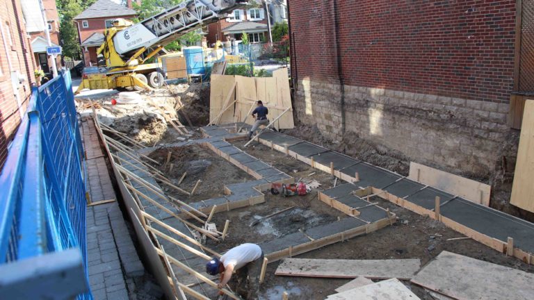 photo of pouring cement into foundation forms