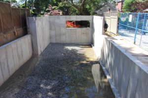 photo of foundation walls after backfill completed