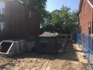 photo of bin and last work to backfill foundation